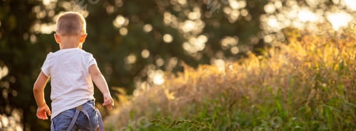 Preview: a child in a wheat field. nature.