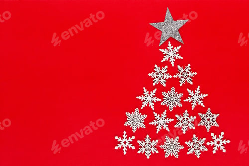 Preview: White snow flake decoration on red background. Flat lay, top view