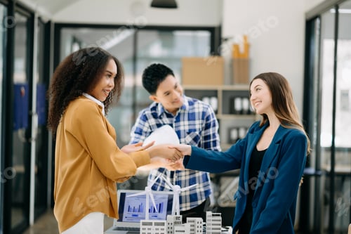 Preview: business people shaking hands during a meeting in office