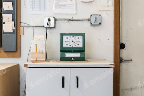 Preview: Timeclock used to check in employees in a woodworking factory.
