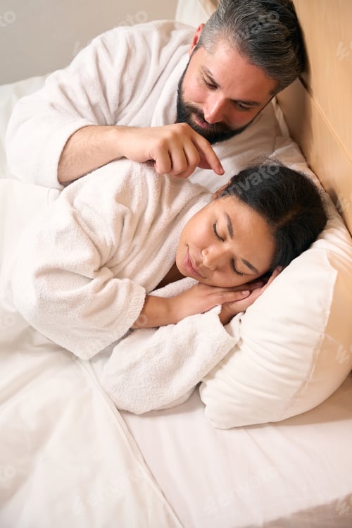Preview: Guy spending time with his sleeping girlfriend in hotel room