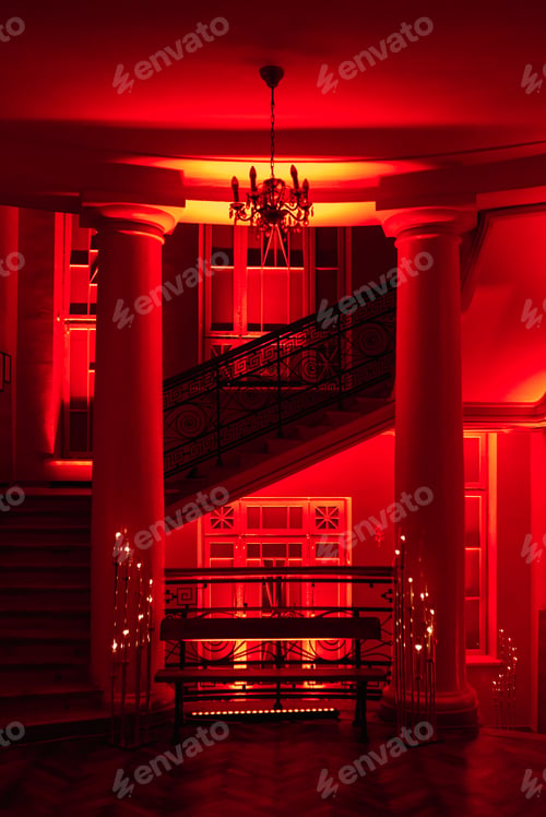 Preview: burning candles on a dark night in a wooden lantern