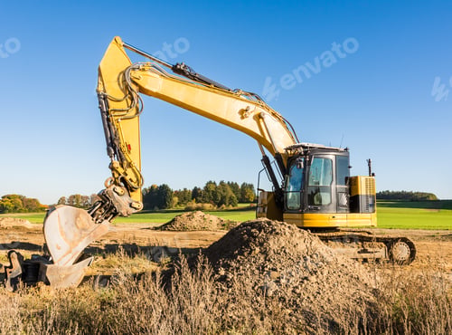 Preview: Yellow earth mover at a construction site