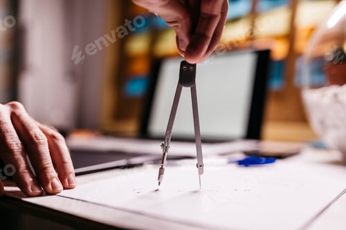 Preview: Man using compasses, close-up
