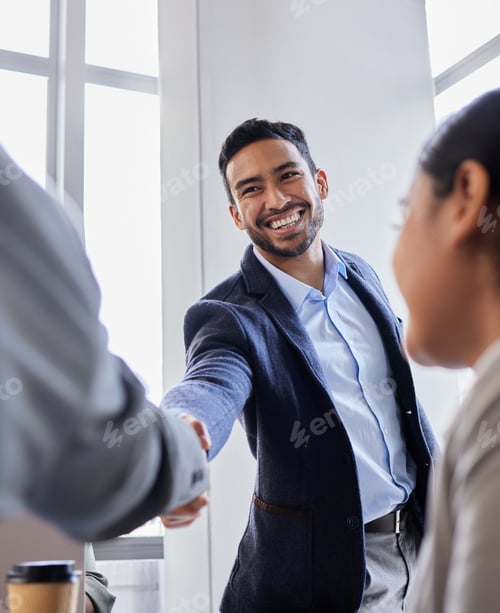 Preview: Pleased to meet you. Shot of two business people shaking hands during a meeting.