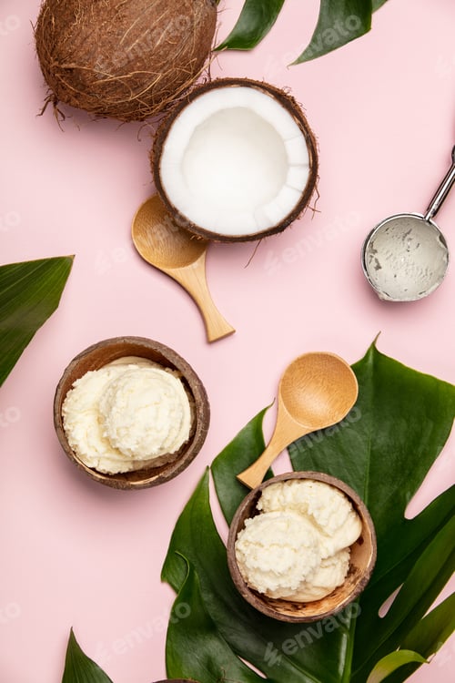 Preview: Creative flat lay with coconut ice cream and tropical plants