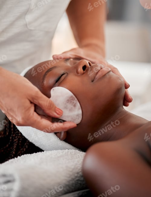 Preview: Black woman face, relax and gua sha stone spa treatment of a young female with facial. Skincare, be