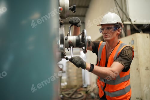 Preview: Maintenance Engineers is working in front of the automated CNC machinery repair on a maintenance che
