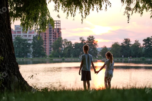 Preview: Happy siblings standing together looking at building under construction. Young children brother and