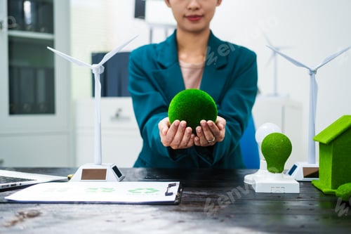 Preview: An Asian businesswoman sits at her desk, discussing clean energy solutions their impact on homes