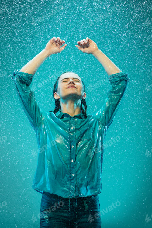 Preview: The portrait of young beautiful woman in the rain