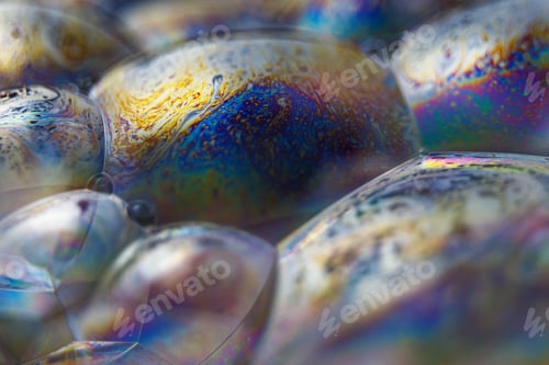 Preview: Abstract texture with bubbles. Rainbow soap bubble on a black background.