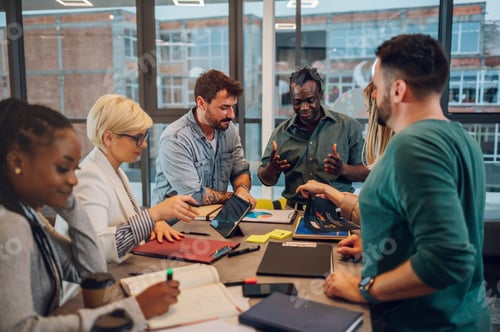 Preview: Multiracial business team working together and having a meeting in the office