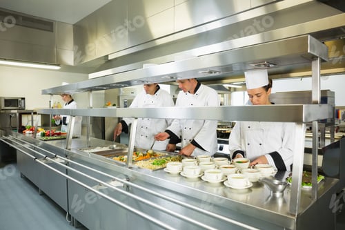 Preview: Four Chefs Working In A Big Kitchen At Service Time