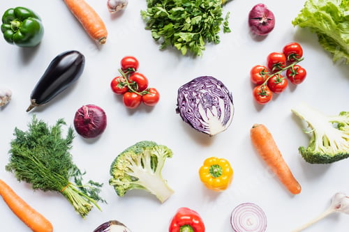 Preview: top view of colorful assorted fresh vegetables on white background