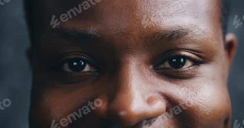 Preview: Black man, eyes and portrait in studio closeup for sight, optometry and vision. Person, reflection