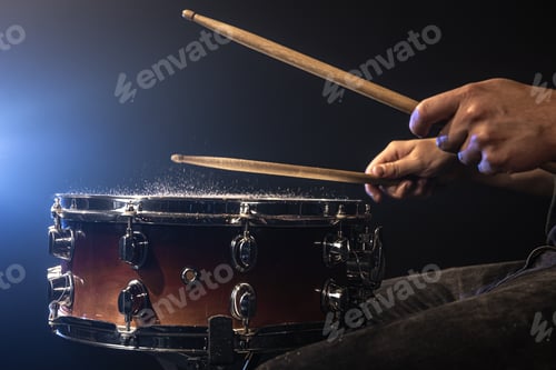 Preview: Close-up, snare drum on dark background with stage spotlight.