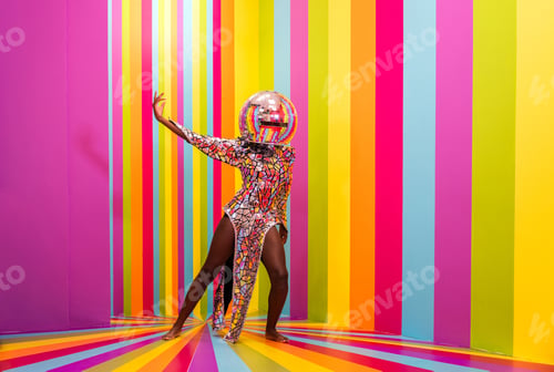 Preview: Beautiful young woman dancing and having fun inside a rainbow box room
