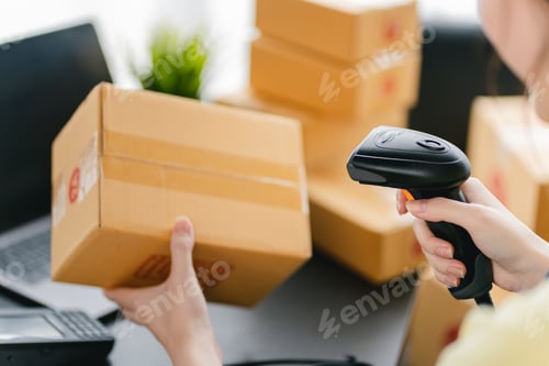 Preview: Portrait of a Small Business Startup, SME Owner, Female Entrepreneur Firing out barcodes check order