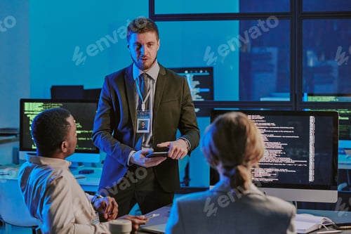 Preview: Young Man Speaking During Meeting In Cybersecurity Office