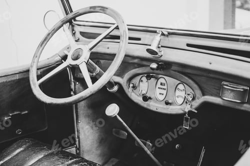 Preview: Grayscale shot of the inside of an old vintage car