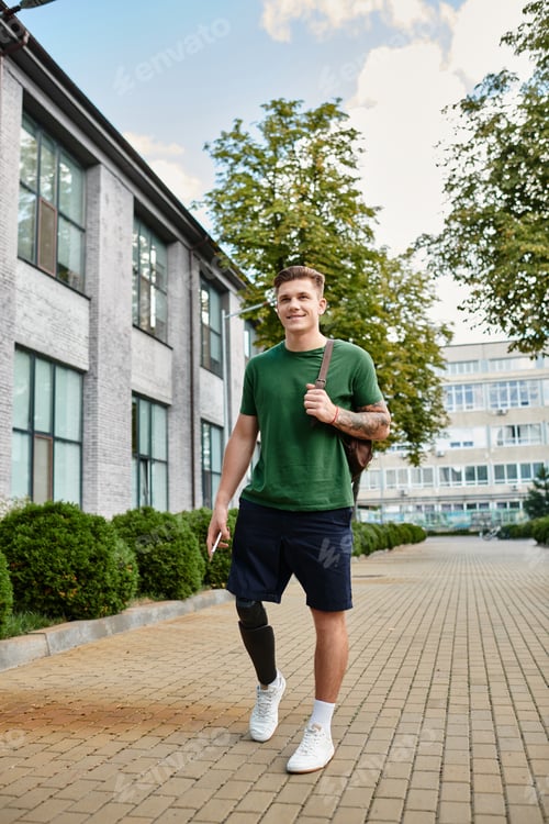 Preview: A young man with a prosthetic leg walks confidently through a sunny park in summer