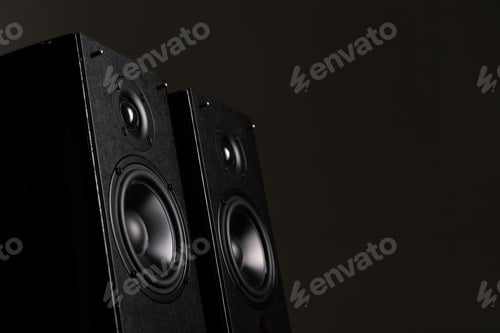 Preview: professional speaker system made of expensive materials on a black background with two speakers and