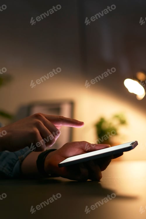 Preview: Close Up Of Woman Using Mobile Phone At Home At Night With Illuminated Screen