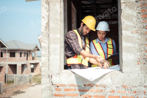 Preview: Architects and engineers work together to assess the residential home construction site's progress