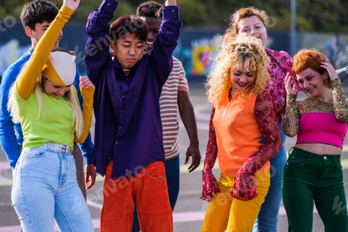 Preview: Group of teenagers of different ethnicities in colorful clothes dancing together