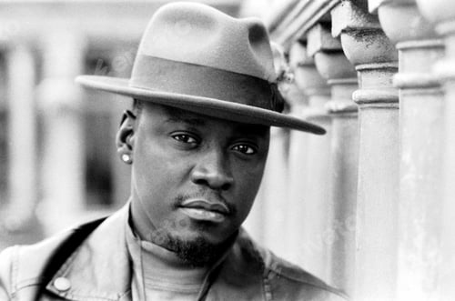 Preview: Interesting black and white portrait of black man outdoors.