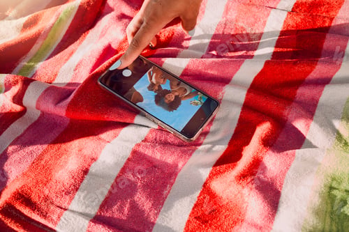 Preview: Hand, phone and selfie by friends at a beach for travel, fun and picture on towel, finger and scree