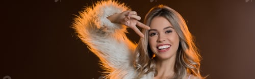 Preview: pleased blonde woman in faux fur jacket showing peace sign on black, banner