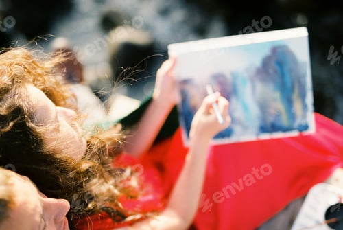 Preview: Woman paints a picture while sitting next to a man
