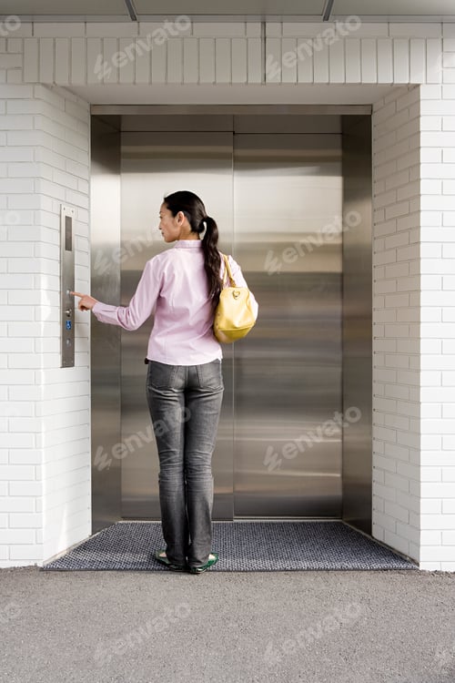 Preview: Japanese woman waiting for an elevator