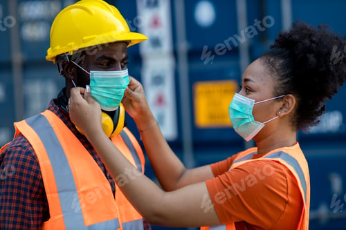 Preview: Wife puts a medical mask on her husband before work. Coronavirus, illness, infection