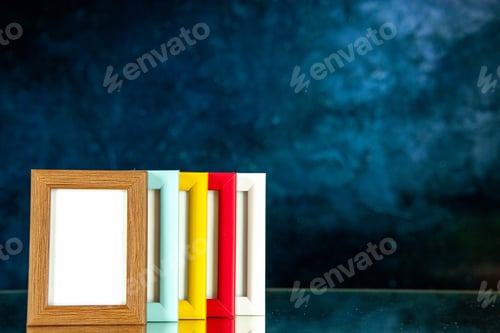 Preview: front view different picture frames with colored corners on dark-blue background photo portrait