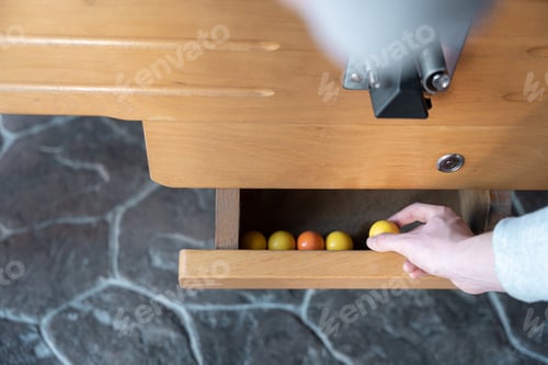 Preview: A young man is taking a table football ball to start the game