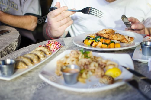 Preview: Variety of plates with delicious food on table