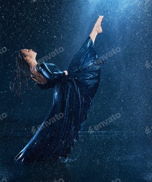 Preview: The young beautiful modern dancer dancing under water drops