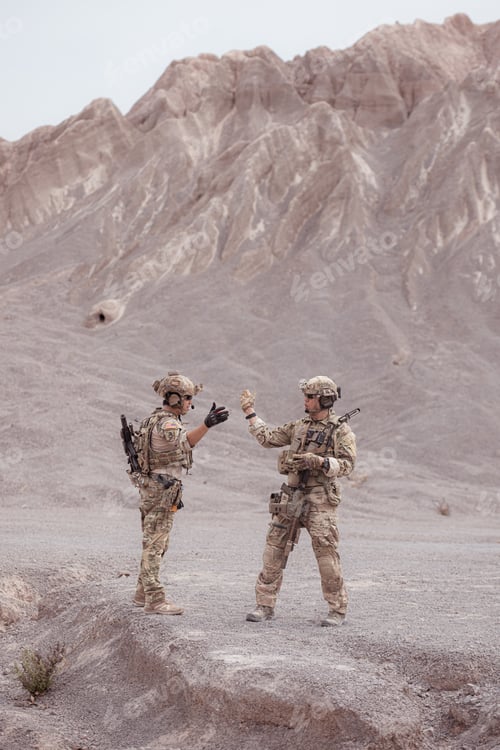 Preview: Soldiers in camouflage military uniforms carrying weapons Reconnaissance missions in rugged mountain