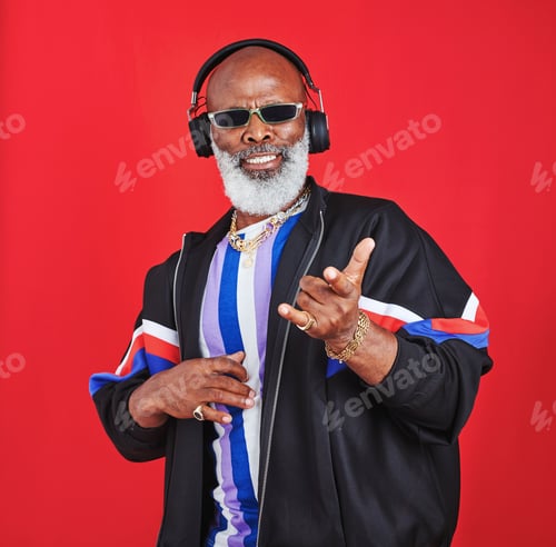 Preview: Shot of a mature man listening to music through headphones
