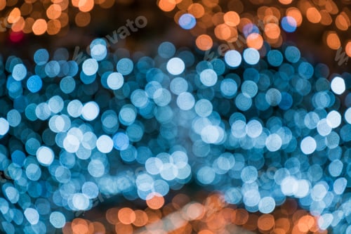 Preview: Blurred blue garland. City night light blur bokeh, defocused background. Christmas abstract.
