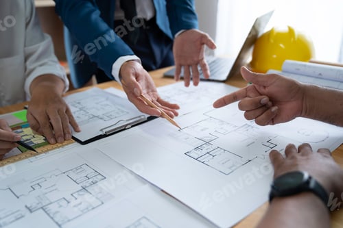 Preview: Businessman and architect meeting for planing and checking house design and house model and secretar