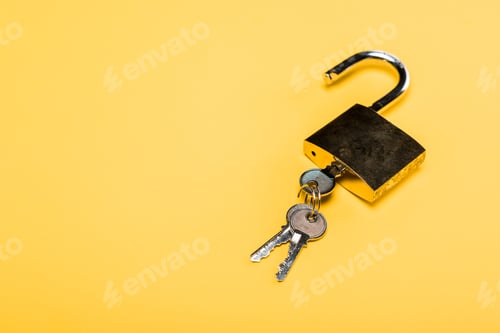 Preview: padlock with keys isolated on yellow