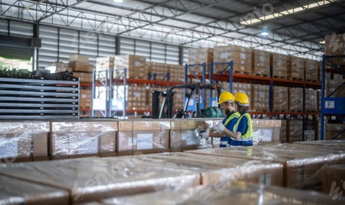 Preview: Warehouse staff verify automotive, paper items using handheld device, ensuring precise shipment.