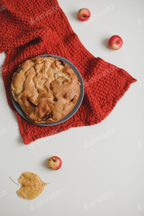 Preview: Homemade Apple Pie on white table background, top view. Classic autumn Thanksgiving dessert -