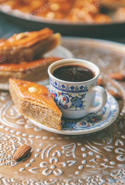 Preview: A cup of Turkish coffee and baklava. Selective focus.