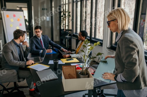 Preview: Businesswoman packing personal items leaving office after getting fired or resigning