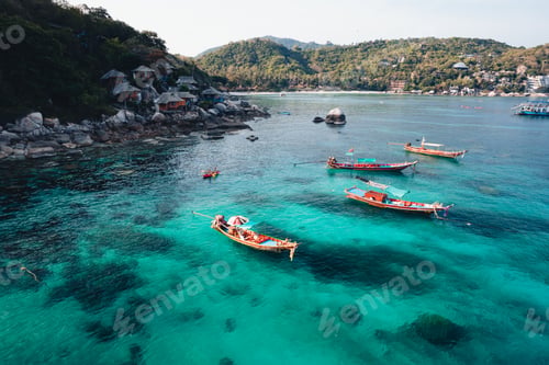 Preview: Island and boat in clear sea at Koh Tao